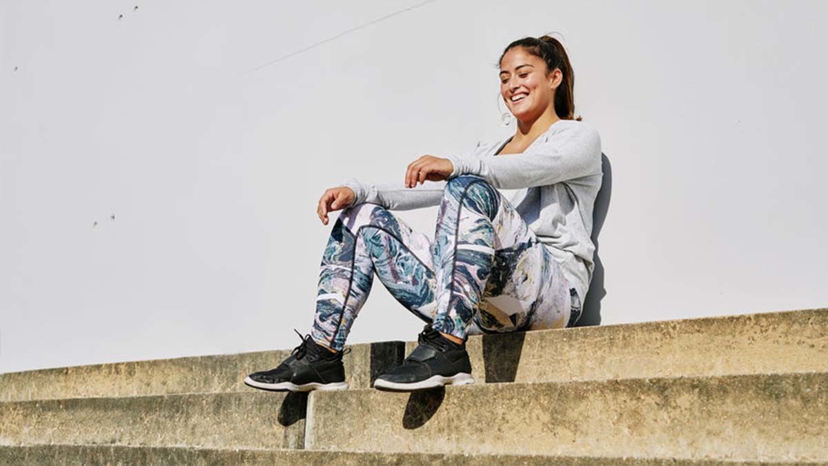 Girl sitting against wall