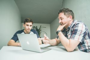 Two friends researching Hidradenitis Suppurativa